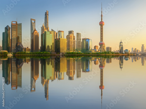 Cityscape of Shanghai and Huangpu River on sunset, beautiful reflection on skyscrapers, China