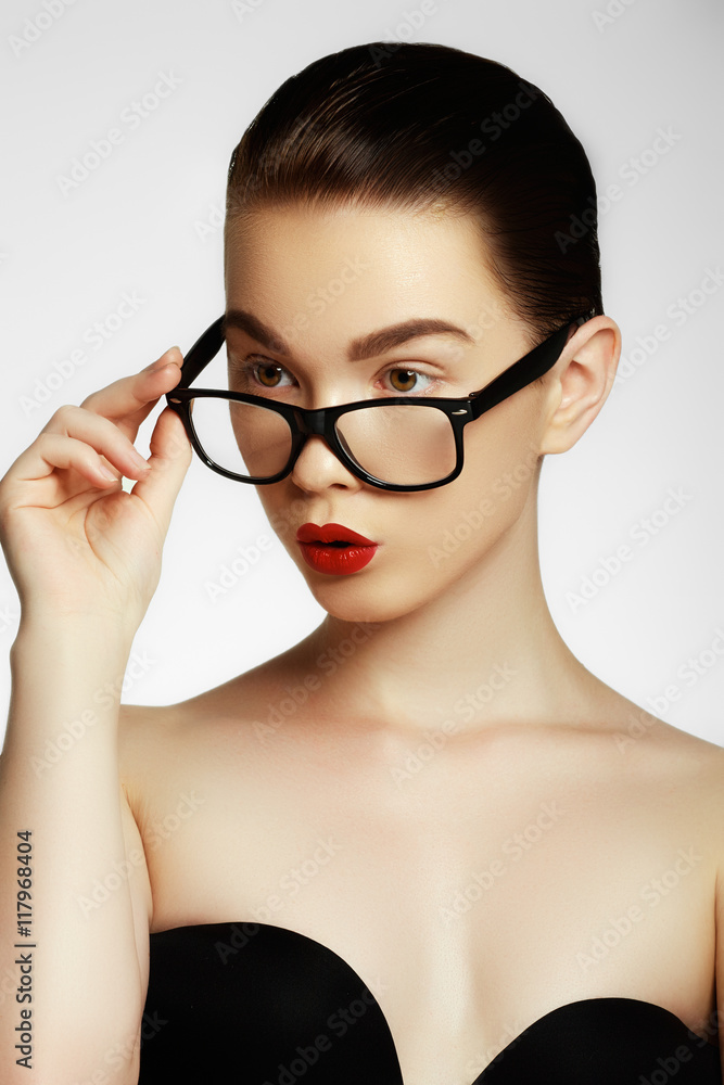 Excited woman looking sideways screaming of joy. Face expressions and people concept - portrait of smiling fashion model glasses. Fashion and accessories Excited woman looking sideways screaming of joy. Face expressions and people concept - portrait of smiling fashion model glasses. Fashion and accessories