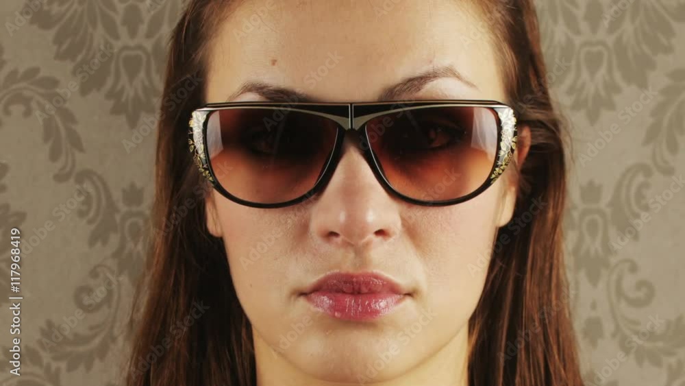 pretty woman wearing different retro sunglasses pretty woman wearing different retro sunglasses