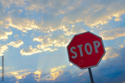 stop sign with clouds in the background