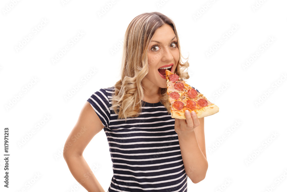 Woman eating a slice of pizza Woman eating a slice of pizza