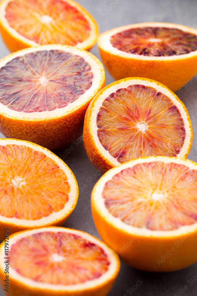 Mixed citrus fruit figs, limes on a gray background. Mixed citrus fruit figs, limes on a gray background.