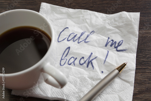 Coffee cup and napkin with message