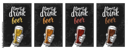 Male hand holding a glass with four types beer - light, white, red and dark.