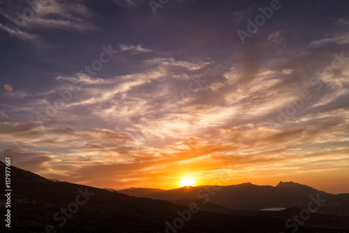 Dramatic sunset sky over Sant' Antonino in Corsica