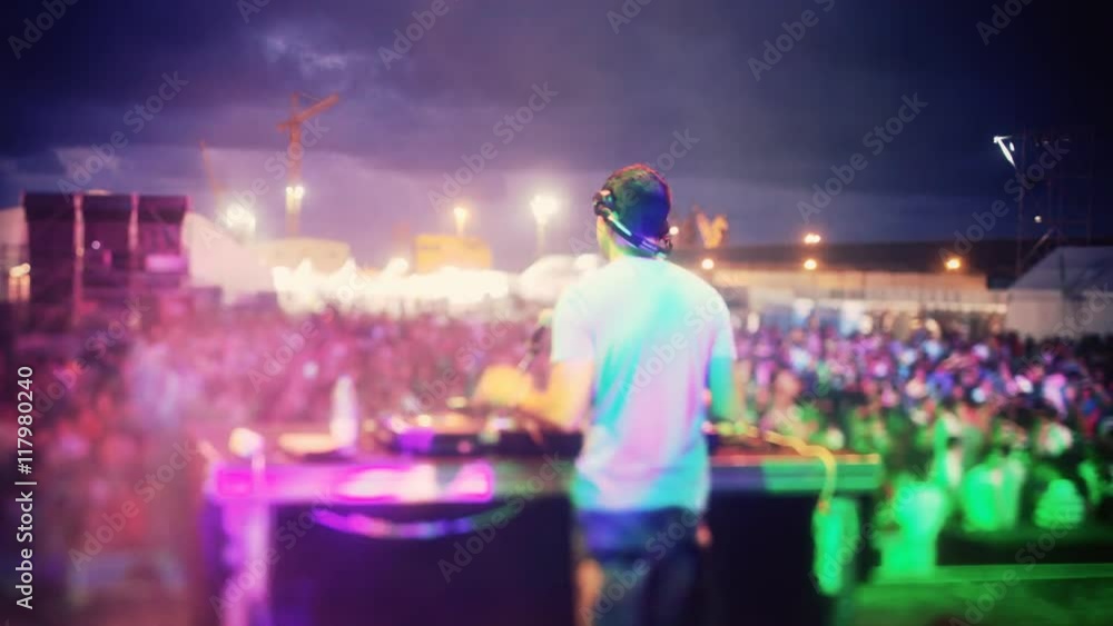 dj looking the crowd at a festival dj looking the crowd at a festival
