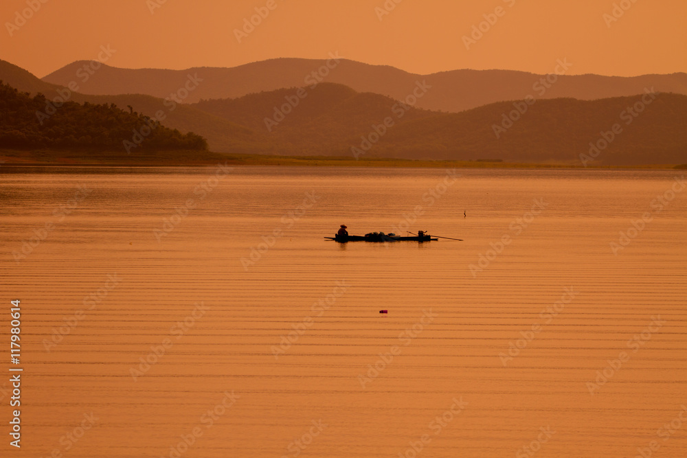 Fototapeta premium fisherman with net at the lake