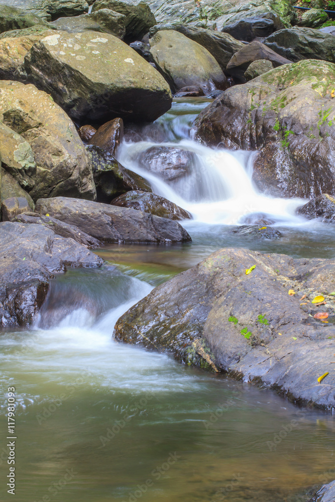 waterfall and rocks covered with moss waterfall and rocks covered with moss