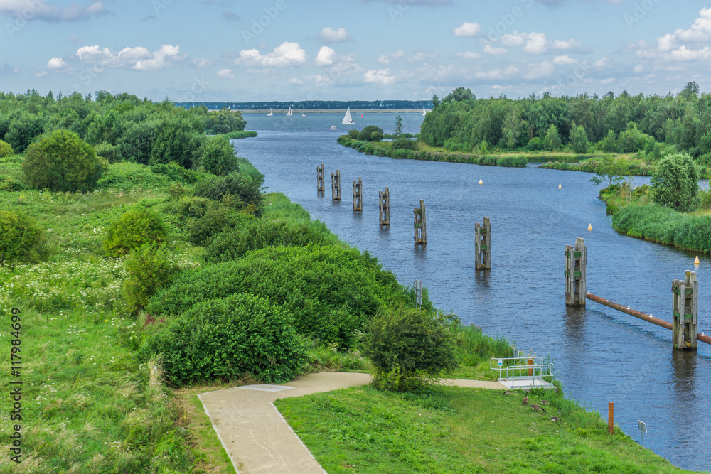 beautiful river landscape with footpath poles and boats sky view