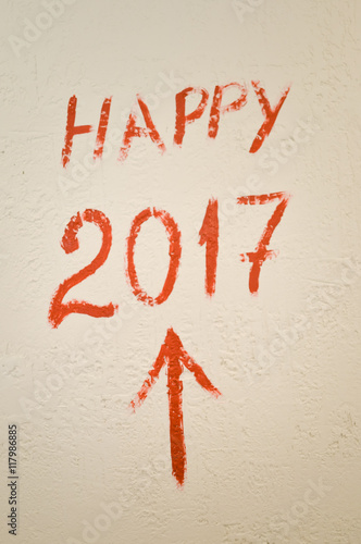 Sigh of Happy 2017 year written on light wall background, closeup