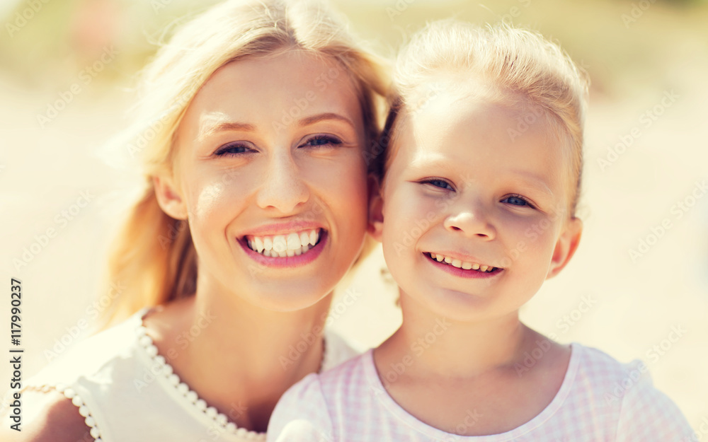 happy mother and little daughter on summer beach happy mother and little daughter on summer beach
