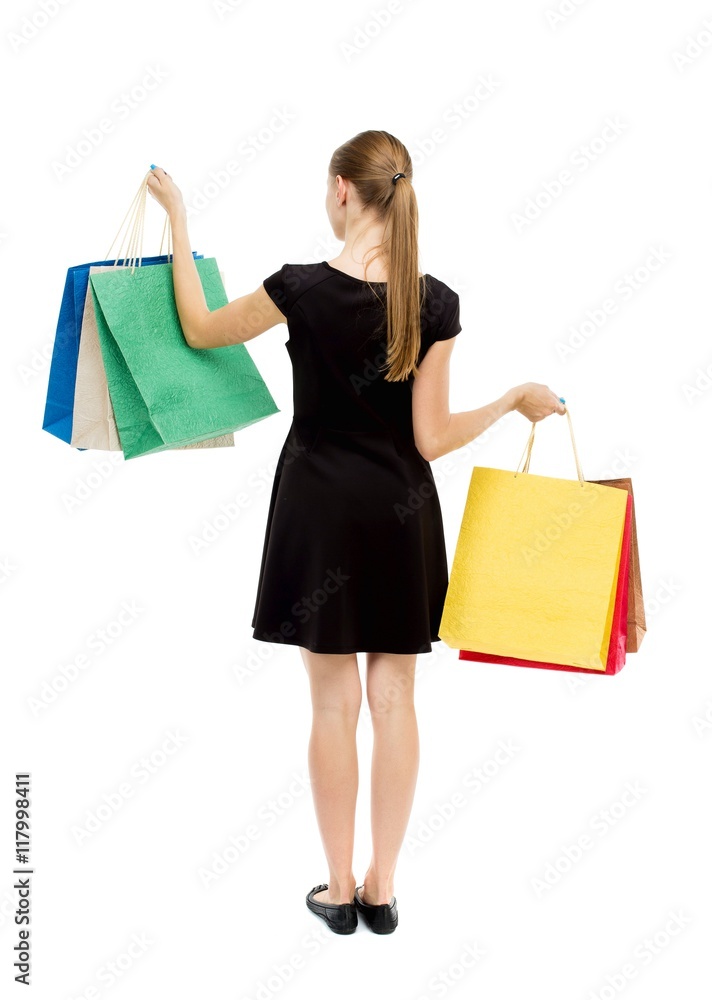 back view of woman with shopping bags . beautiful brunette girl in motion. backside view of person. Rear view people collection. Isolated over white background. The blonde in a black short dress back view of woman with shopping bags . beautiful brunette girl in motion. backside view of person. Rear view people collection. Isolated over white background. The blonde in a black short dress