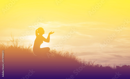 silhouette woman knee down with her hands