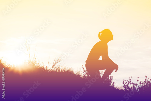 silhouette woman knee down with her hands