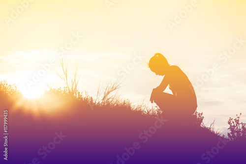 silhouette woman knee down with her hands