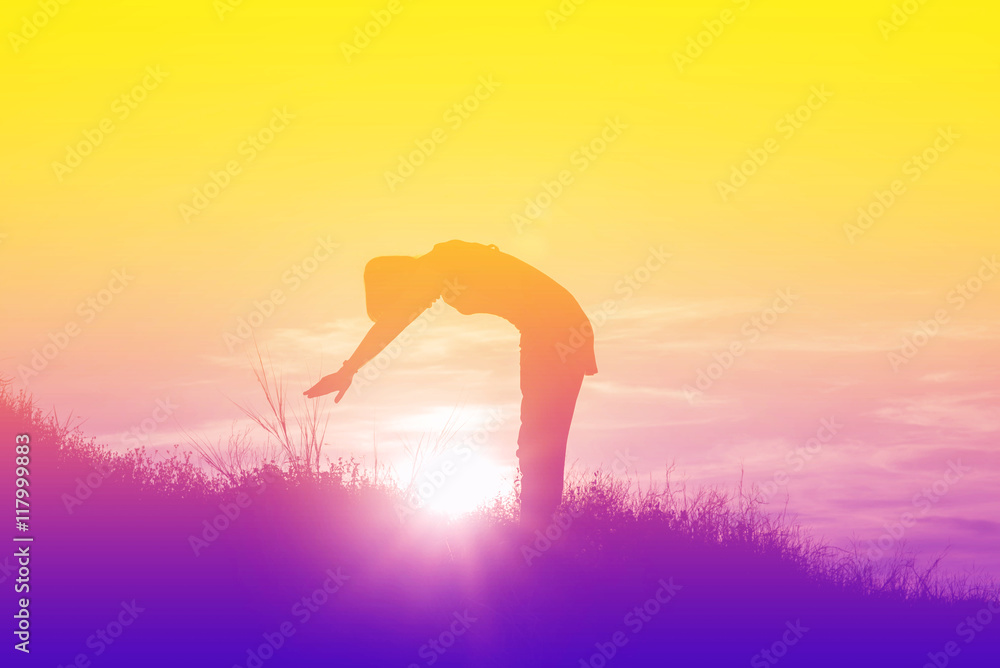 Silhouette of woman So happy at sunset