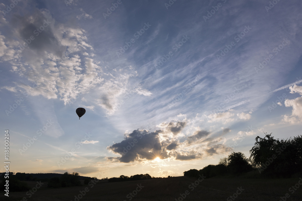 Sunset sky and silhouette of a hot air balloon