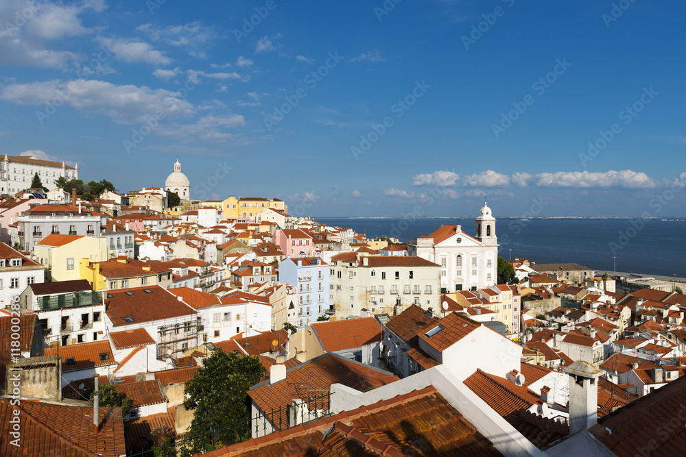 View of the Alfama neighborhood in Lisbon, Portugal from the Portas do Sol viewpoint; Concept for travel in Lisbon, Portugal