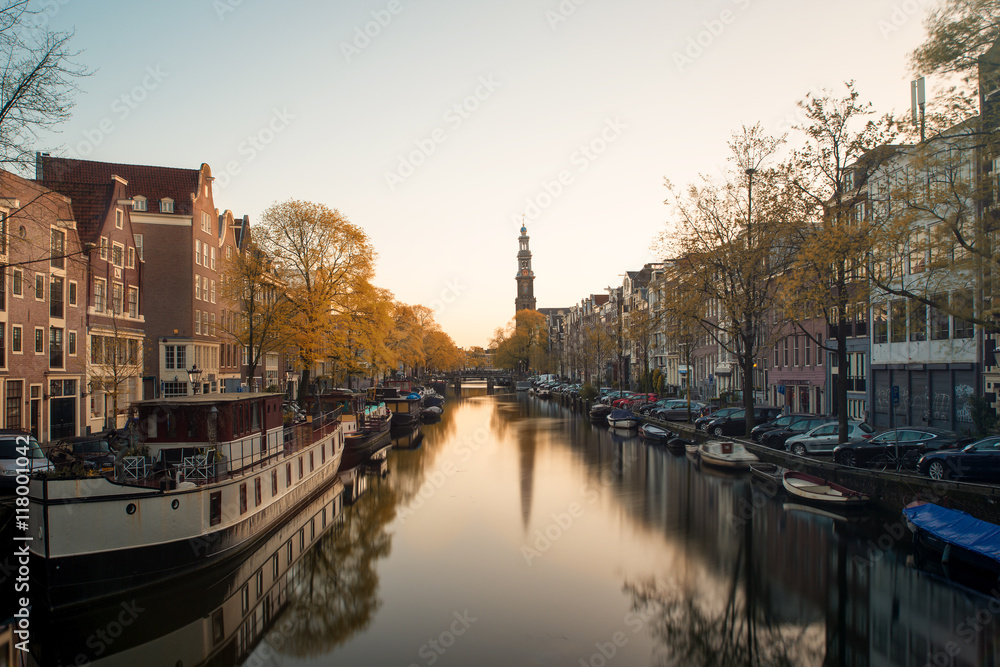 Westerkerk church and canal at morning in Amsterdam, Netherlands