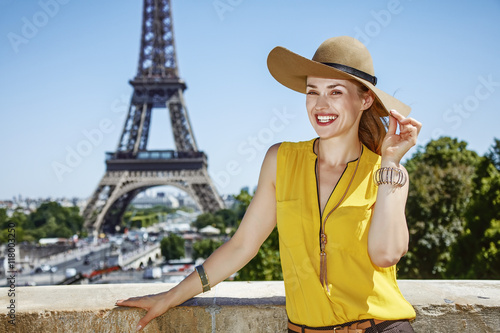 happy young woman in bright blouse in Paris, France © Alliance