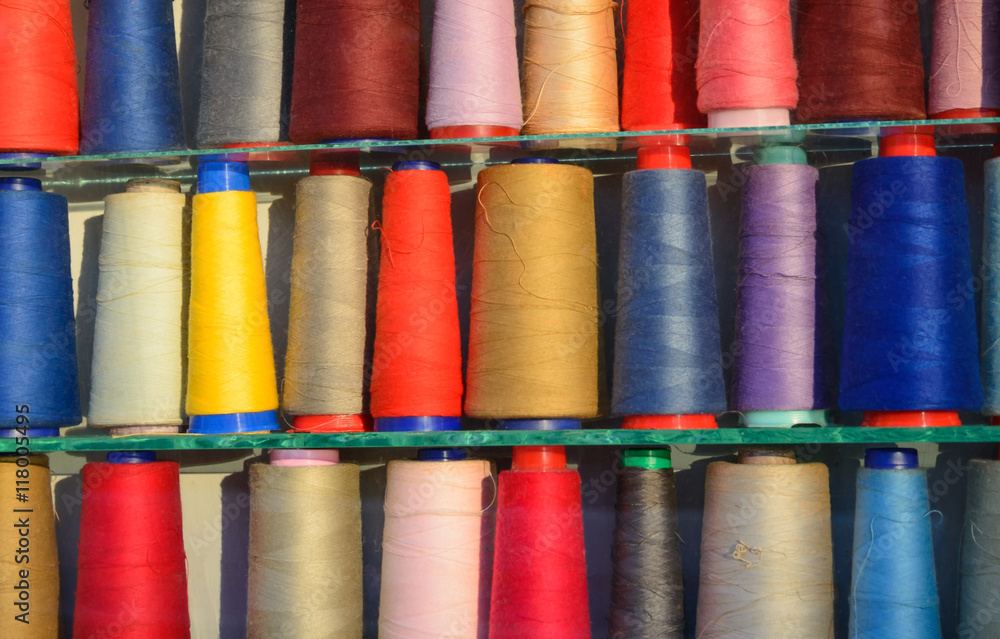 Multi-colored coils of threads Multi-colored coils of threads