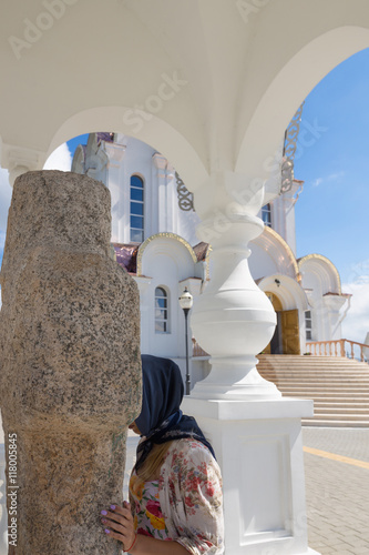 Turov, Belarus - August 7, 2016: Cathedral of Saints Cyril and Lavrenti girl worships the holy stone of Turov June 28, 2013 in the town of Turov, Belarus. photo