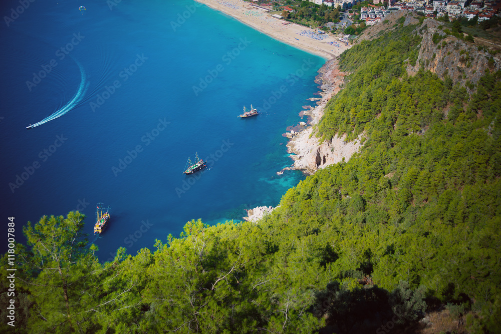 Obraz premium yachts float in a quiet comfortable blue lagoon among the mountains of turkey