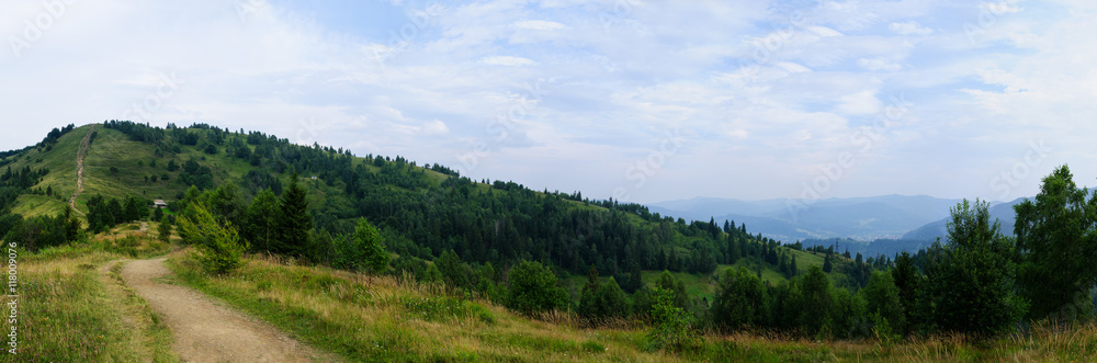 Summer landscape in mountains and the dark blue sky with clouds