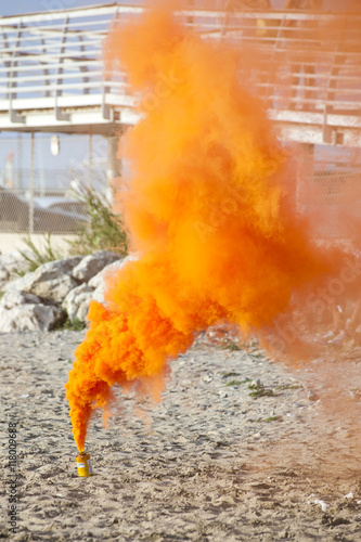 Orange smoke bomb photo