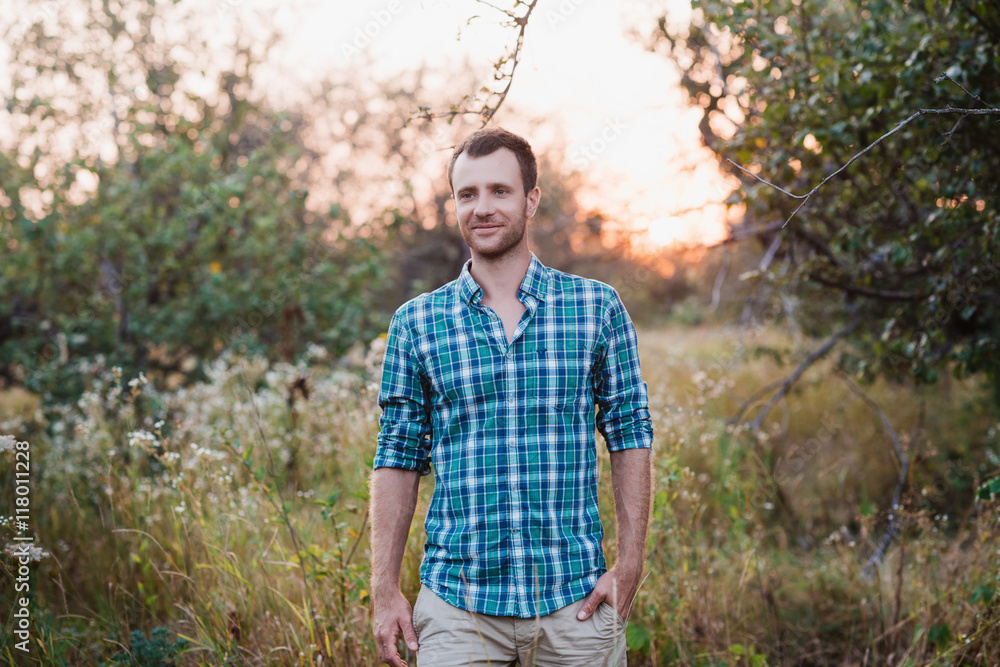Portrait of a Man in plaid shirt on nature Portrait of a Man in plaid shirt on nature