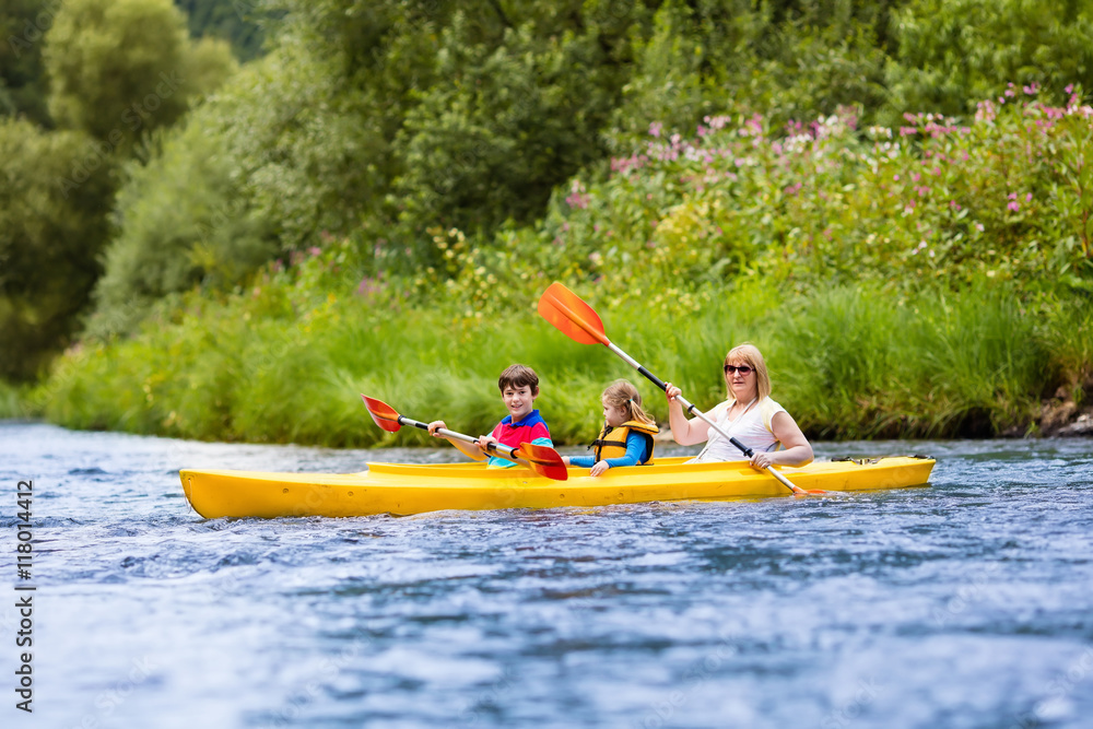 Family enjoying kayak ride on a river