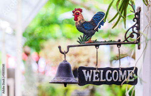 Doorbell welcome to home, Old cock symbol bell for ring and welc photo