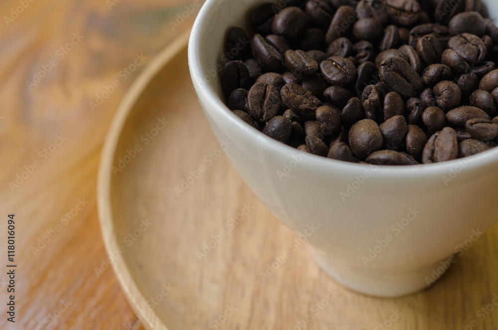 Coffee beans in a white cup. Selective Focus. Coffee beans in a white cup. Selective Focus.