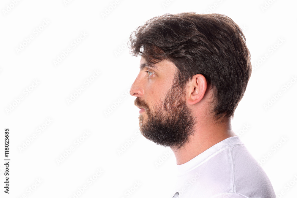 Obraz premium Man standing profile in a white T-shirt . Close up.