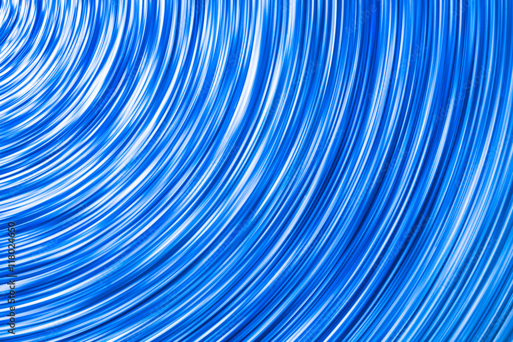 Abstract rotating neon lights texture.