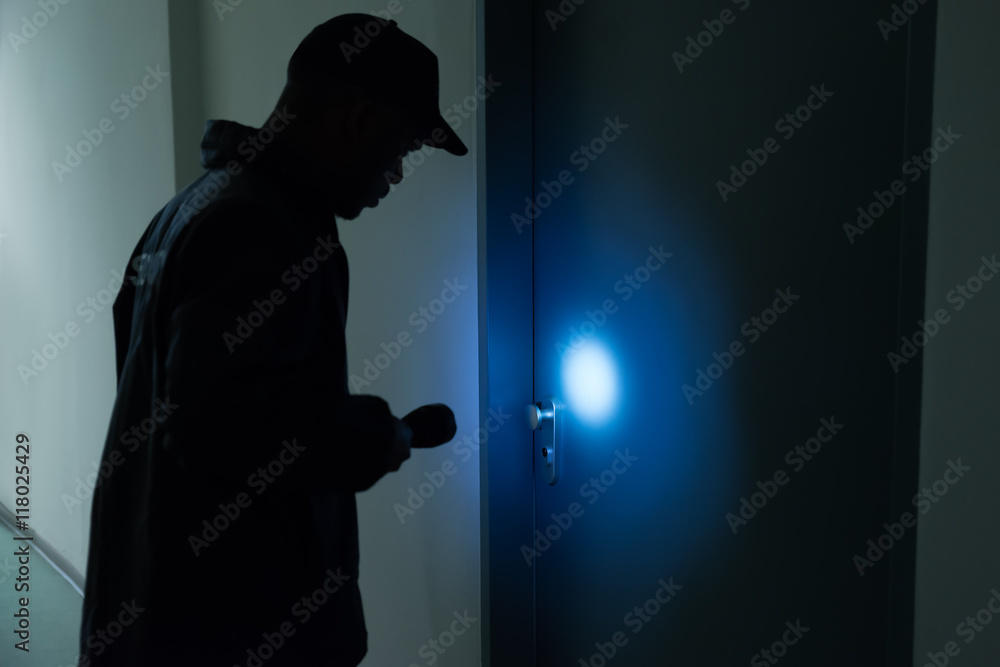 Male Security Guard With Flashlight