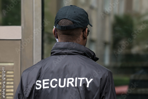 Rear View Of A Security Guard