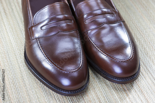 Footwear Concept and Ideas. Men's Stylish Brown Penny Loafers Shoes