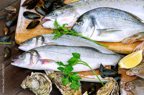 Fresh raw seafood on a wooden board.