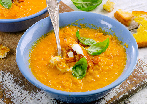 Carrot soup with fresh basil.