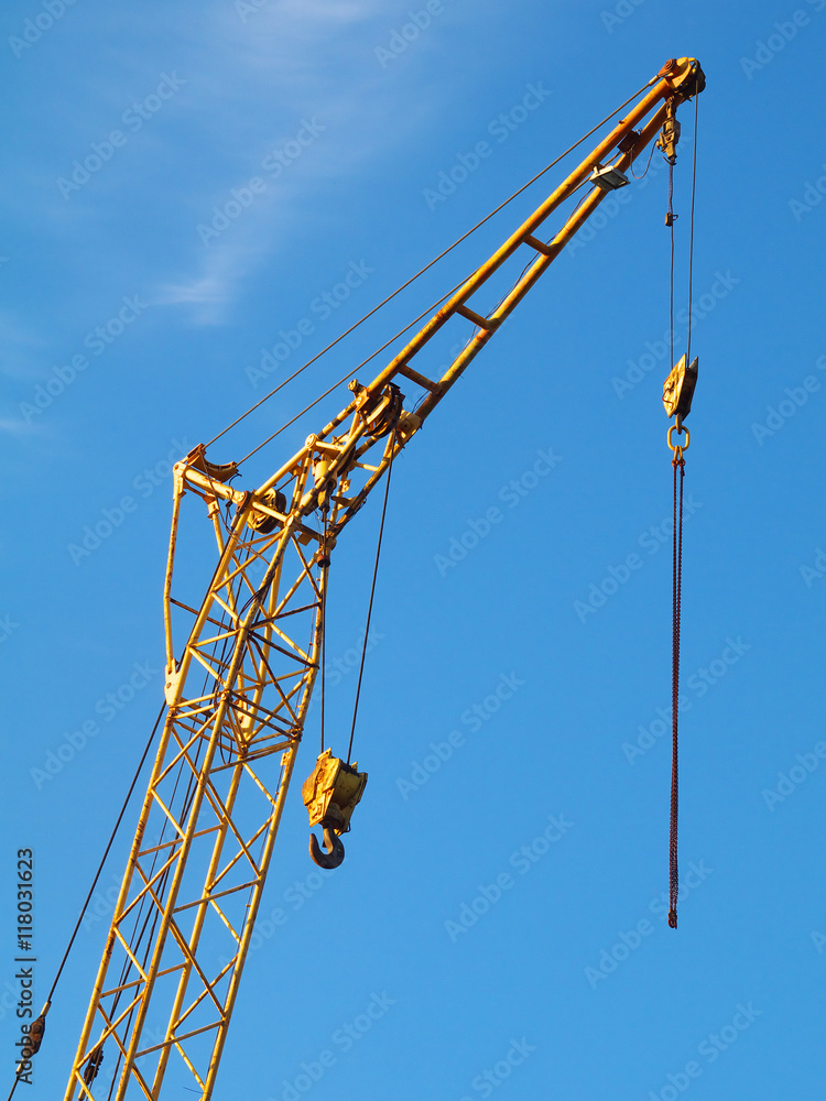 fragment of mobile crane boom against blue sky fragment of mobile crane boom against blue sky