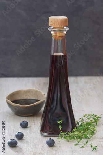 Blueberry and thyme vinegar with fresh fruits and herbs