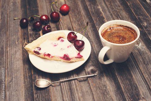 Vintage background. Slice of homemade cherry pie and cup of coffee