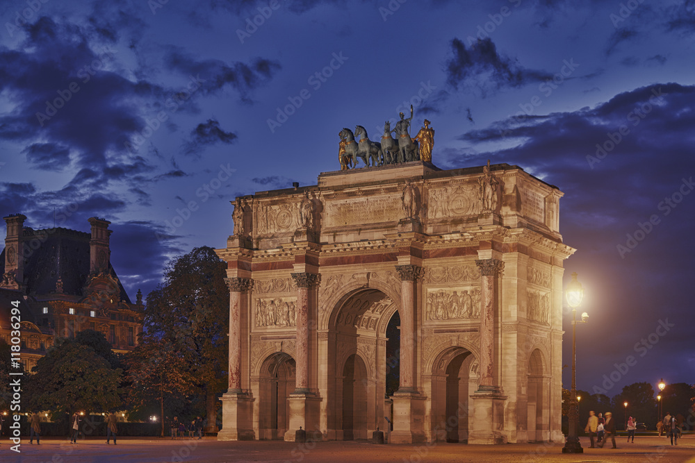 Triumphal Arch (Arc de Triomphe du Carrousel) at Tuileries gardens in Paris, France. Monument was built between 1806 - 1808 to commemorate Napoleon's military victories.