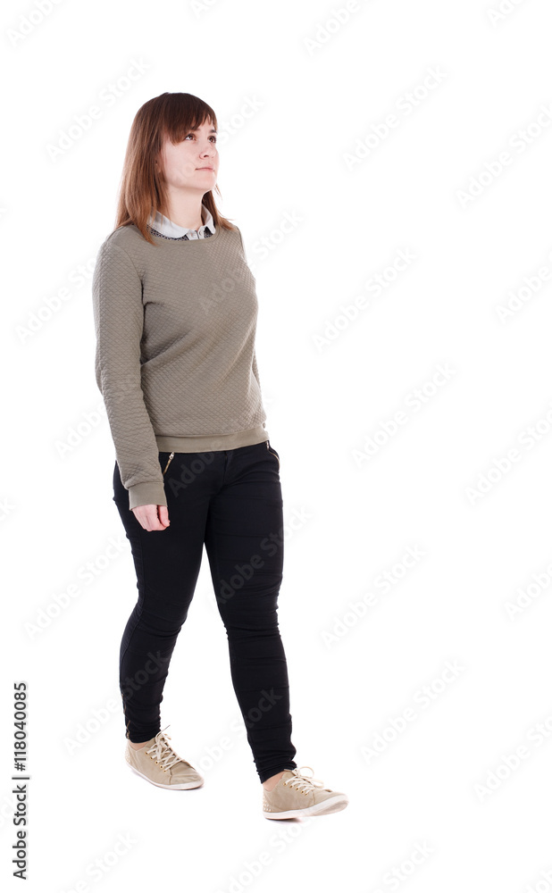 Foto Stock Side view of hot blonde in leggings and top looking at