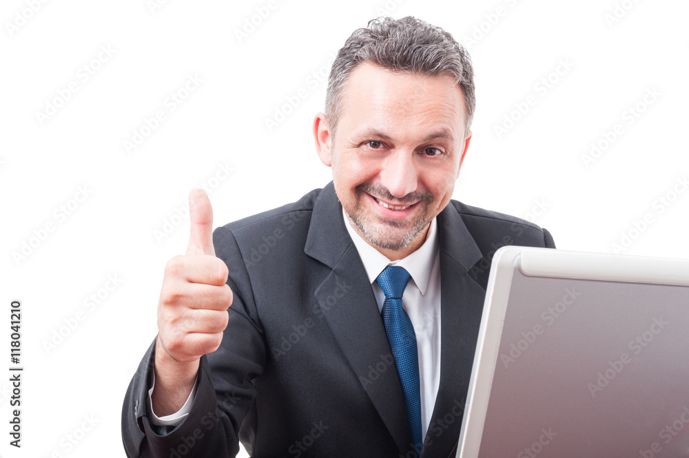 Attractive executive manager showing thumb up Attractive executive manager showing thumb up