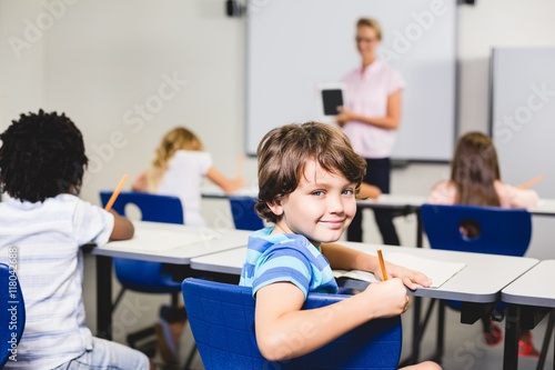 Smiling boy looking at camera during lesson