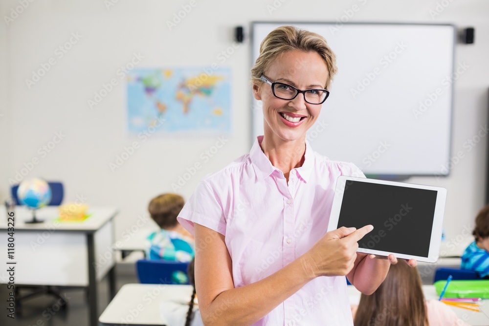 Portrait of teacher pointing at the digital tablet Portrait of teacher pointing at the digital tablet