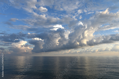 Scenic clouds over the sea at sunset