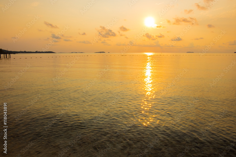 Fototapeta premium Tranquil seascape of calm sea during sunrise in dawn
